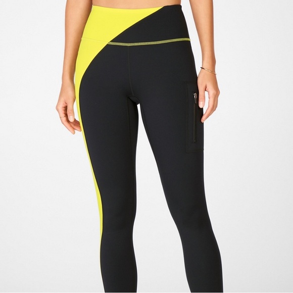 Fabletics Pants - FABLETICS HIGH WAISTED MOTION 365 ZIP POCKET BLACK AND YELLOW COLOR SIZE MEDIUM